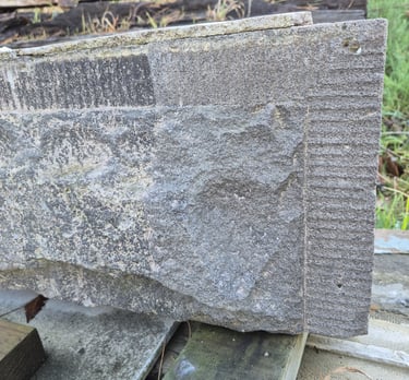 Basalt stone buiding detail partially restored with laser cleaner in Christchurch New Zealand