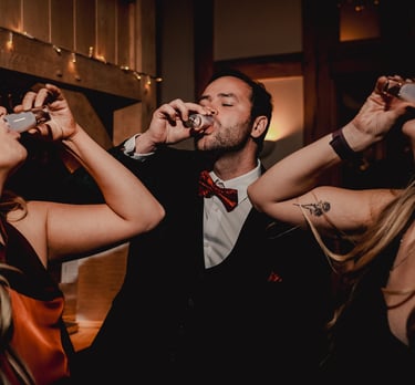 Bride and groom walking through gardens in Leeds – wedding photography by The Wedding Edit