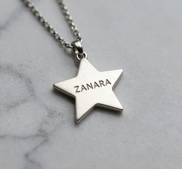 Elegant silver necklace with a minimalist design displayed on a white marble surface with soft natural light.