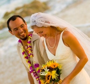 Beach Destination Wedding. Bride and Groom Photo Shoot. Smiling and walking on the beach. San Jose del Cabo, Mexico.