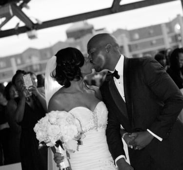 Groom and Bride kissing. Root top wedding at the Rockville Arts & Innovation Center, Rockville, MD