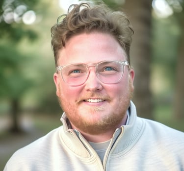 a man with glasses and a white jacket