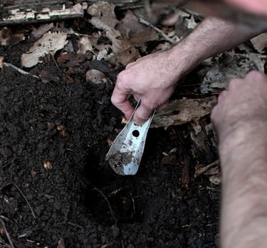man digging with boglerco trowel
