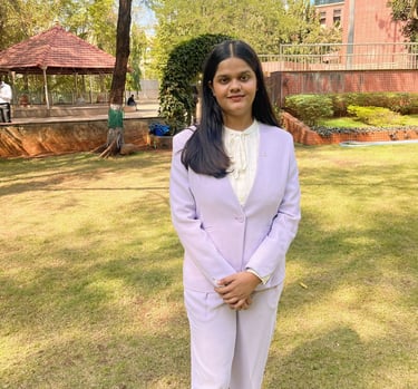 a woman in a white suit and white shoes