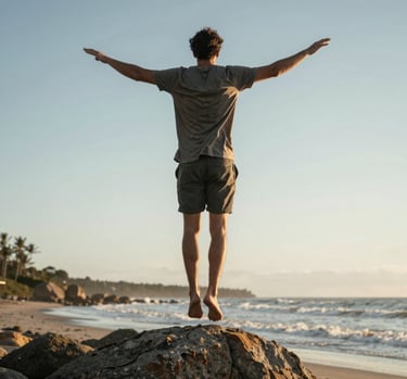 silhouette of man raising his hands during sunset