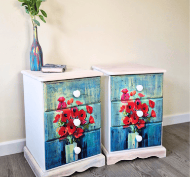 A pair of bedside tables painted white with 'Poppy' design decoupage