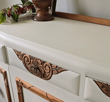 Angle view of sideboard painted in Sophie James Cream Dream to show the carved wood detail