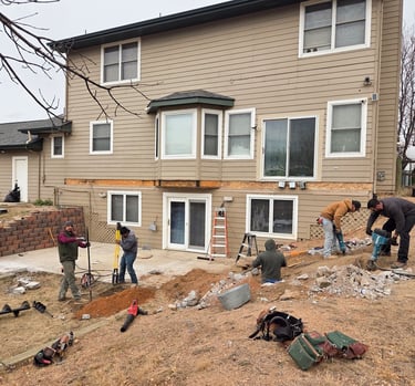 Construction site preparation and initial framing for a large-scale residential deck project.