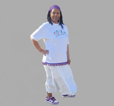 a woman in a white shirt and purple pants