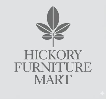 Hickory Furniture Mart logo featuring a gray leaf emblem above serif typography on a light background.