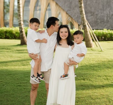 Father carrying his child during a family photography session at The Apurva Kempinski Nusa Dua Bali