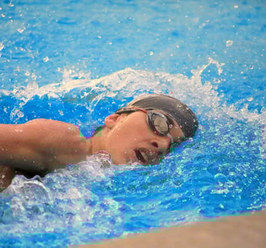 Sports Photo of Swimmer Cutting Through the Water