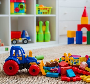 a toy truck with a toy tractor and toys