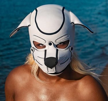 Person posing in a pup mask.