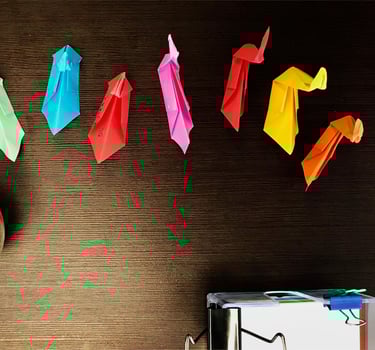 Origami birds of different colors.