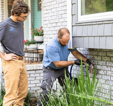 Clint Smith (Owner) Performing a pest control prevention operation