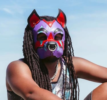 Man in pup mask at the beach.