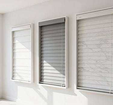 Bright minimalist interior showroom, natural light reflecting on marble-look PVC panels, clean modern display of custom blinds on the wall, 35mm lens