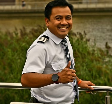 the first Asian Hotel Manager in European river cruise in uniform smiling on deck