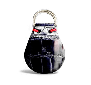 Luxury black crocodile embossed leather key fob with a silver ring and red accents.