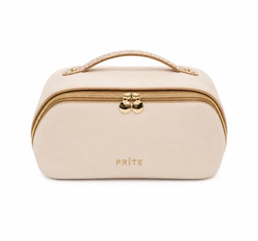 Beige makeup bag with gold hardware isolated on a white background.