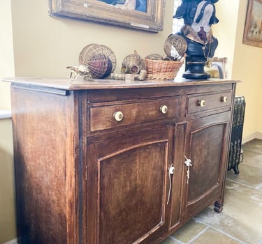 Image of a sideboard that is brown wood and could be painted