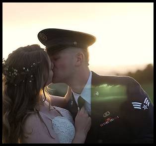 Military couple kissing at the bridge near Christie's of Genesee