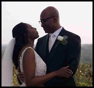 Couple holding each other outside a venue