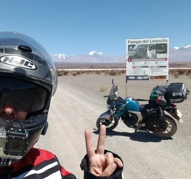 a man in a helmet and helmet on a motorcycle