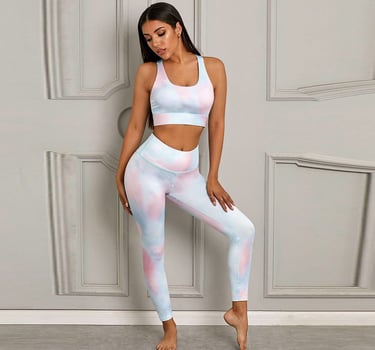 a woman in a pink and blue tie dye outfit