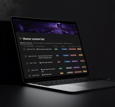 A laptop displaying a digital content calendar and master list for social media planning.