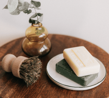 soaps, vase and rose