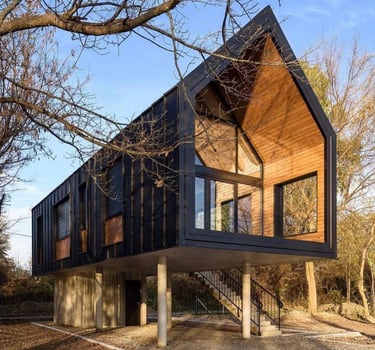 Blakc container house on pillars