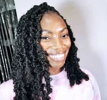 a woman with big black butterfly locs hairstyle