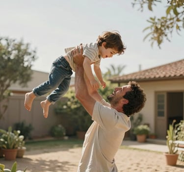 A medium shot of a father lifting his son toward the sky. The lighting is bright and airy, featuring soft sand and almond colors in the environment. A joyous, authentic moment in a Western / Global backyard garden.