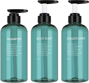 three bottles of body washer with a bottle of shampooe