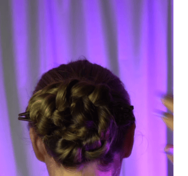 a woman with a hairdoodle updo with a braid braid