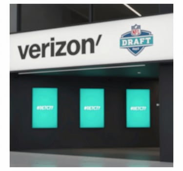 A sophisticated architectural photo of a Verizon flagship interior during the NFL Draft. Minimalist design, sharp lines, with digital displays glowing in #0E7C7B teal against #111111 dark interiors. High-end editorial style.