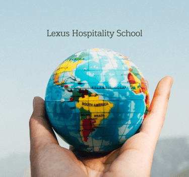 Globe in hand for Lexus Hospitality School, representing global hospitality career potential.