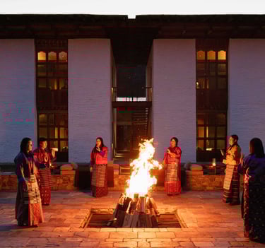 Amankora-Thimphu-performing-traditional-folk-songs-and-over-firepit-at-lodge's-terrace