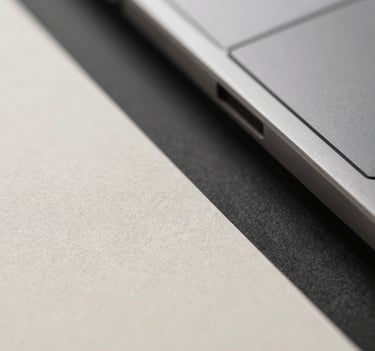 An abstract close-up image showing the texture of premium paper stock next to a sleek metal architectural detail, symbolizing the brand's material connection. Lighting is atmospheric and high-end, using #4A5763 and #F8F8F4 tones.