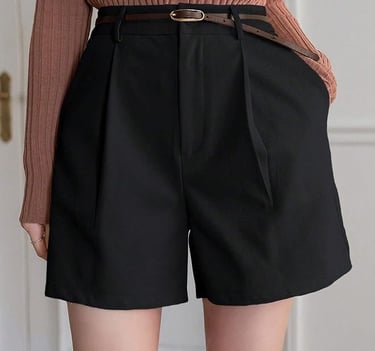 Black shorts with a brown belt to complete the outfit