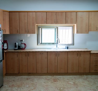 a kitchen with a refrigerator and a refrigerator freezer