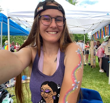 A smiling woman in a tent