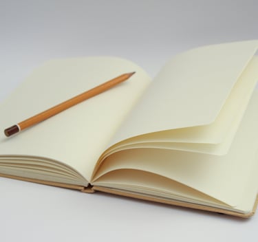 a pencil and pencil on a notebook with a pencil and pencil
