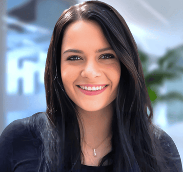 a woman with long hair and a black top
