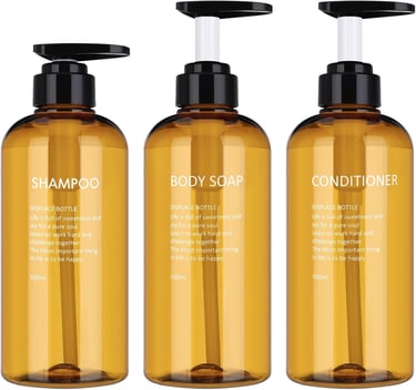 three bottles of body washer with a bottle of shampooe