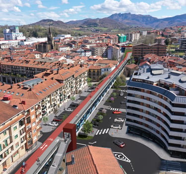 Aerial view of a modern urban bike path and pedestrian walkway integrated into a European city landscape.