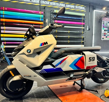 BMW CE 04 electric scooter wrapped in white and orange vinyl finish