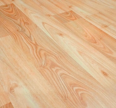 Light brown oak laminate flooring with realistic wood grain texture for home interior design.
